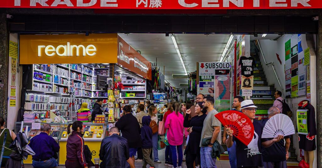 pexels-photo-33388288-33388288 Crowded trade center with diverse shoppers and colorful market stalls bustling with activity.