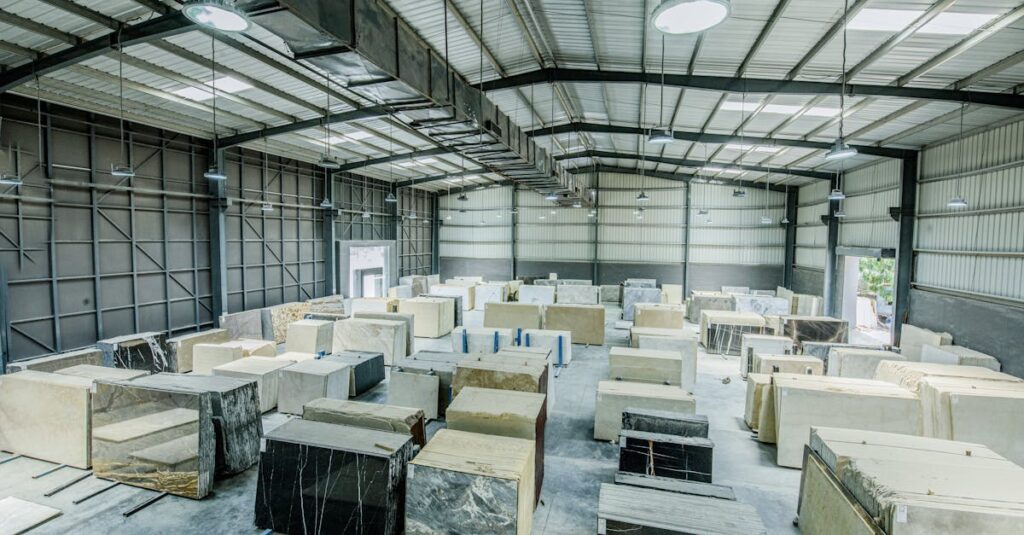 pexels-photo-5827062-5827062 Expansive warehouse filled with large stone slabs for industrial use.